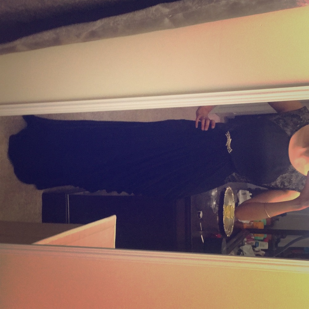 Black gown with removable brooch by Alejandra sky